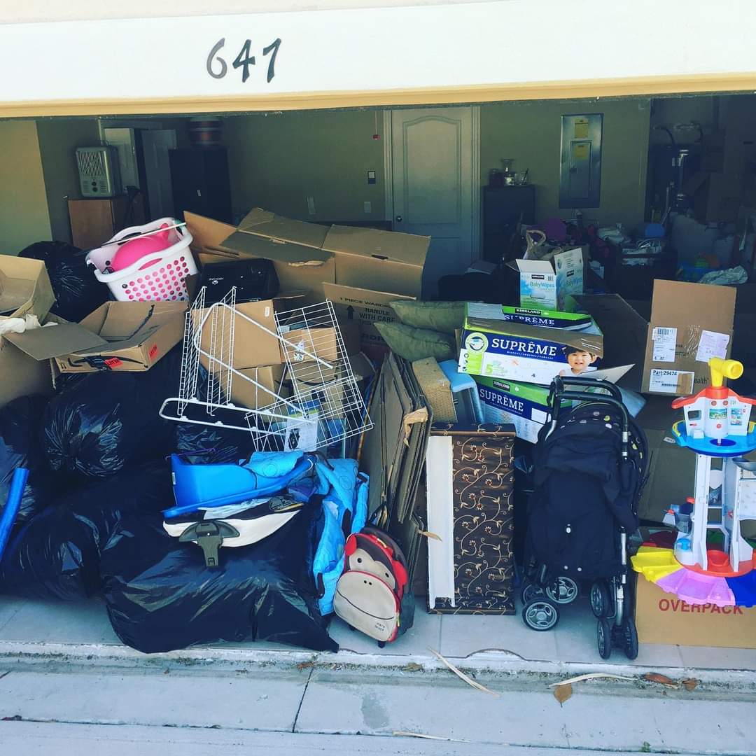 4 GREEN PLANET Junk Removal crew hauling junk in Orlando, Florida