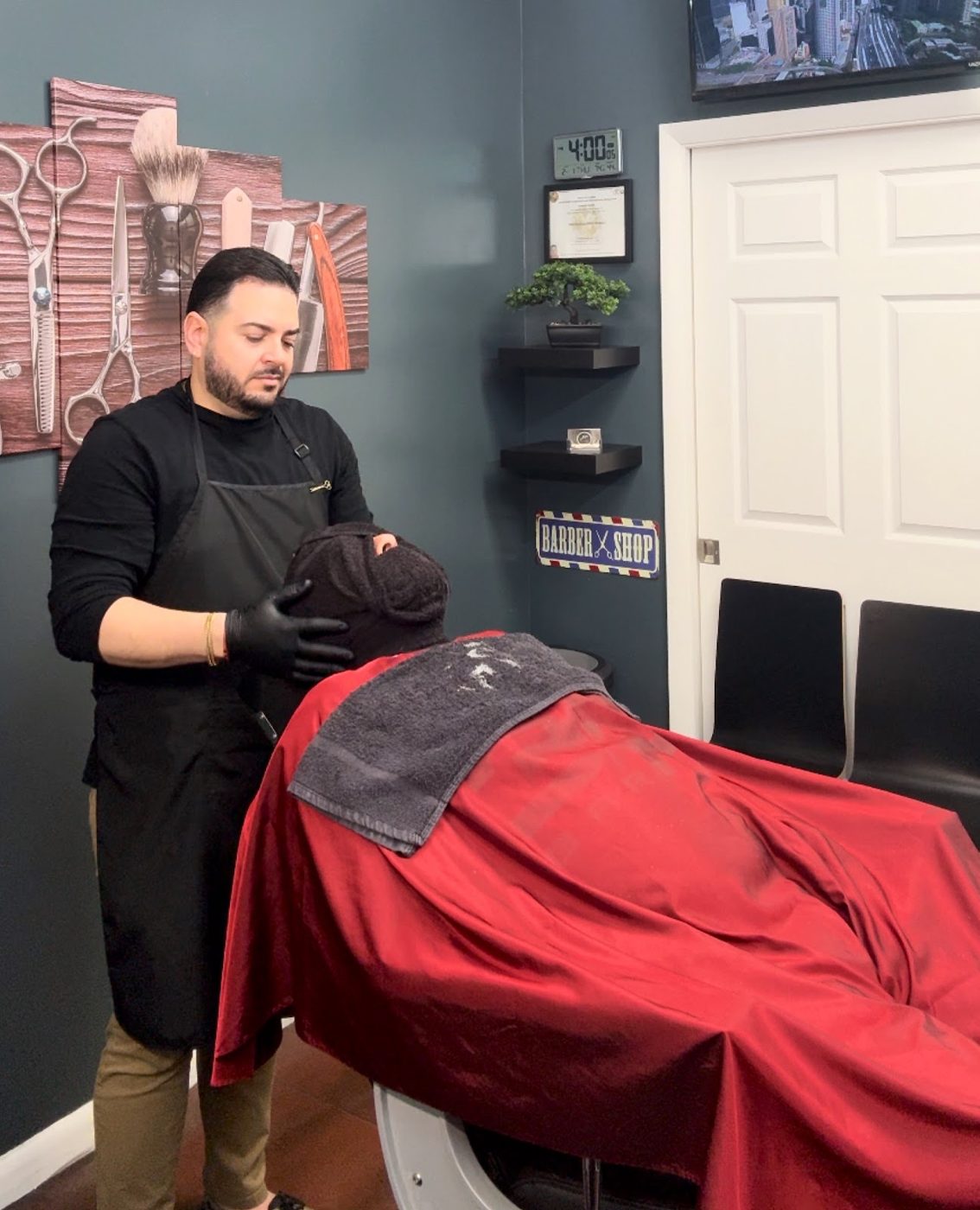 JP giving a hot-towel treatment at his Lake Nona studio