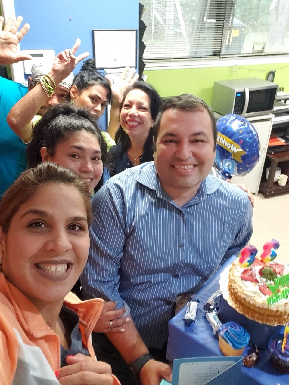 The Nona Medical Services team smiling together during a celebration