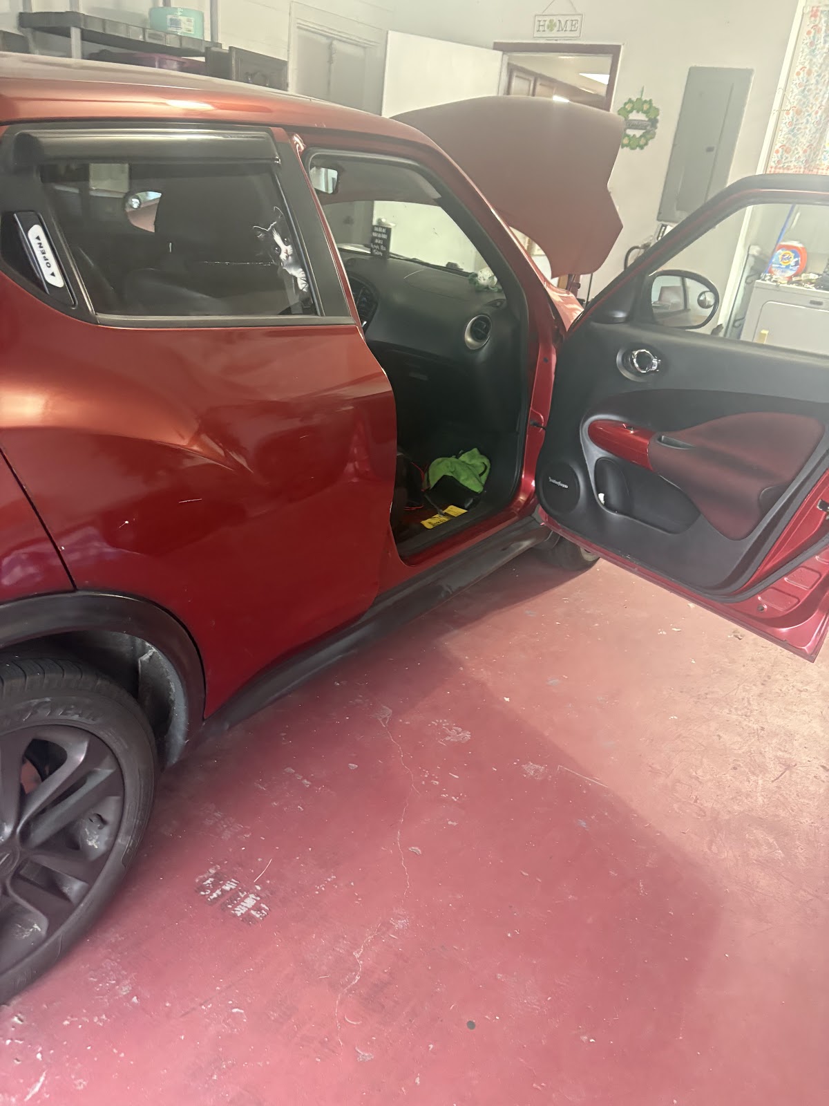 our mechanic working under the hood at a customer's home
