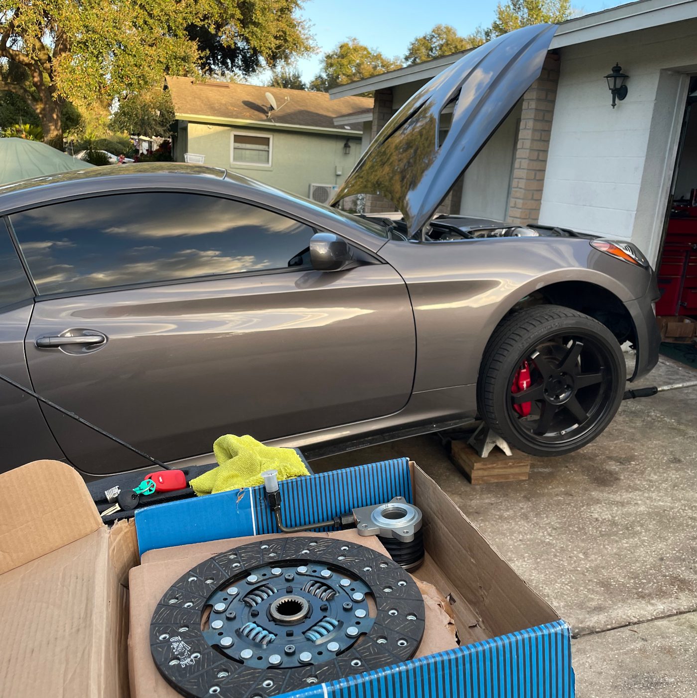 Pat working under the hood at a customer's home