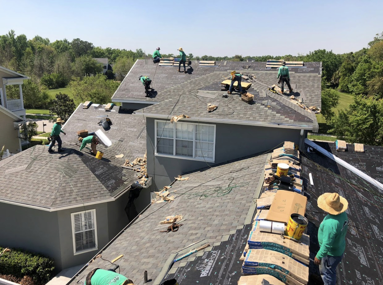 Aging, storm-damaged roof before Sky Light Roofing Inc. replacement
