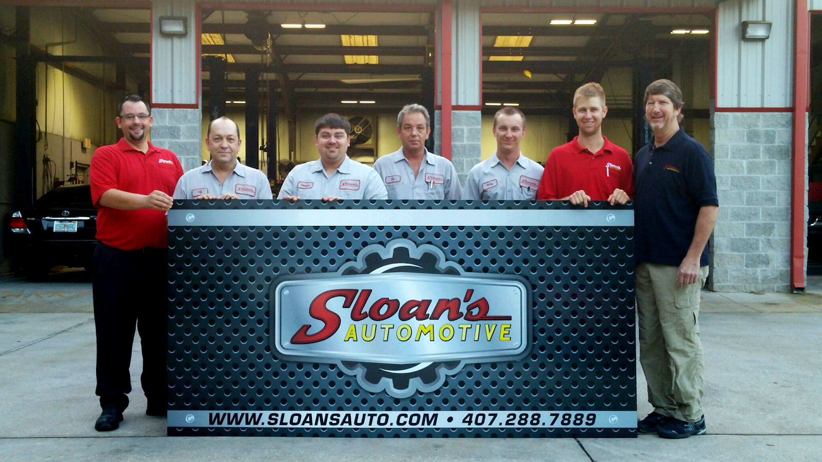 Sloan's working under the hood at a customer's home