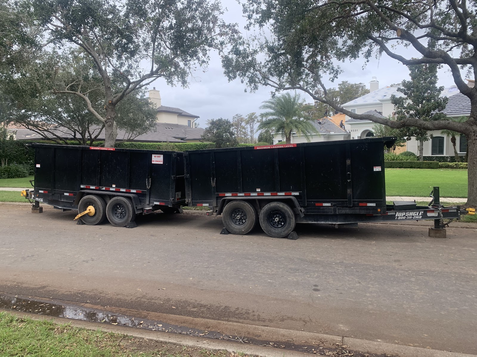 World of Dumpsters and Junk Removal crew hauling junk in Orlando, Florida